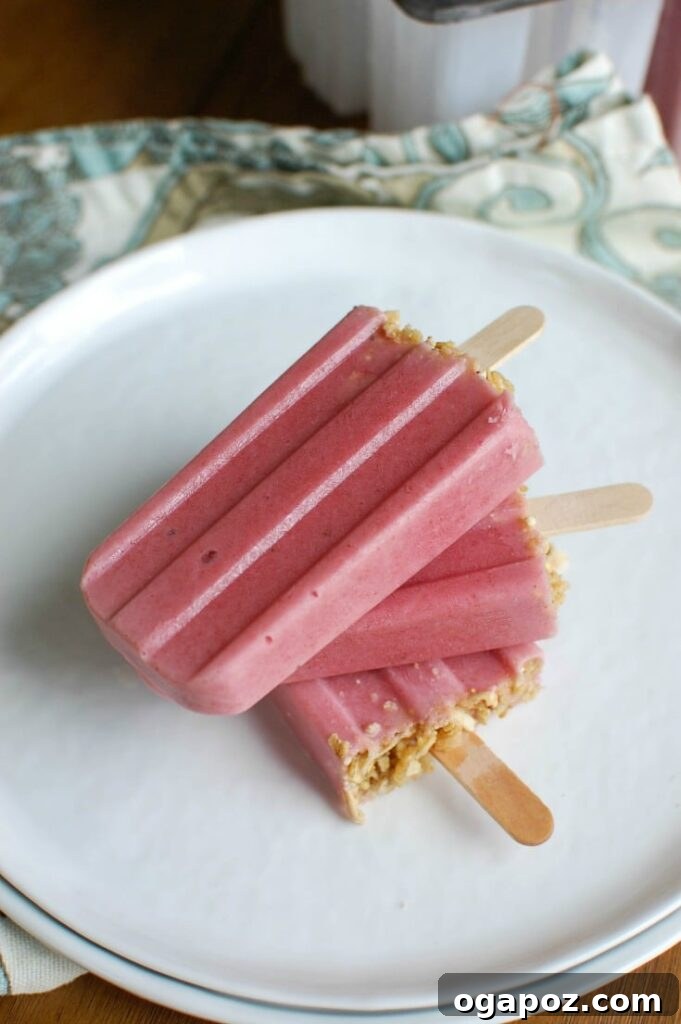 Strawberry Banana Yogurt Swirl Pops 2 Delicious Strawberry Banana Yogurt Popsicles in a mold, a perfect healthy summer treat for kids and adults.