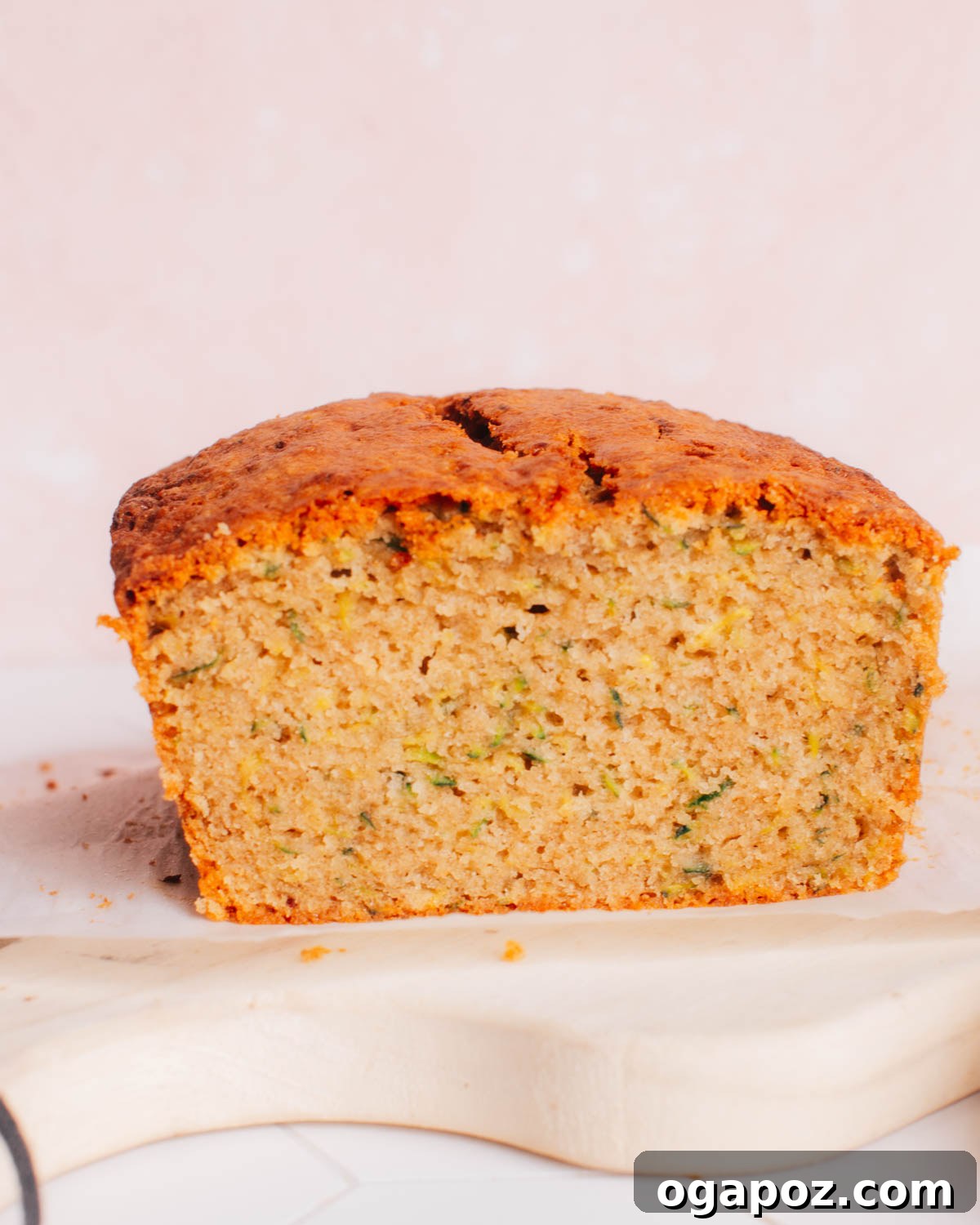 Perfectly Soft and Moist Banana Zucchini Bread 3 Ingredients for Banana Zucchini Bread laid out on a table, including mashed bananas and grated zucchini.