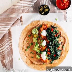 Hearty Mexican Rice, Bean, and Greens Burritos 6 A vibrant and delicious Greens, Mexican Rice, and Refried Bean Burrito, ready to be enjoyed.