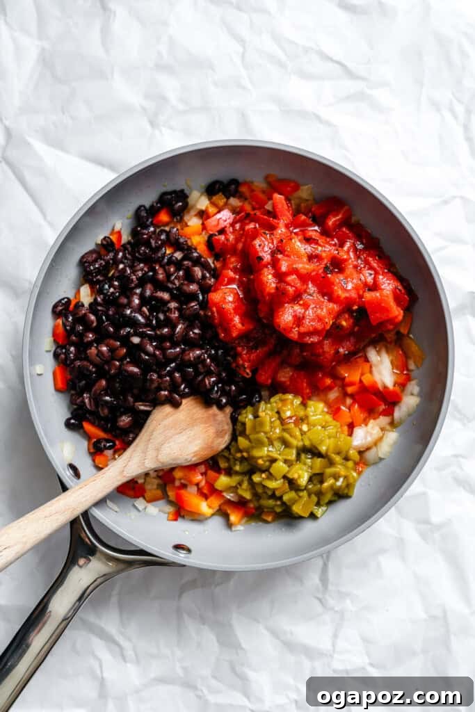 Effortless Vegetarian Enchiladas 10 Black beans, diced tomatoes, and green chiles added to sautéed vegetables in a skillet.