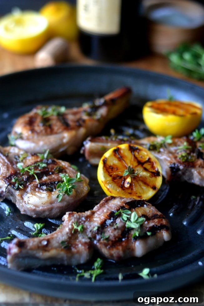 Wholesome Meals in Minutes 23 Lemon Thyme Lamb Chops served with fresh lemon slices and herbs.