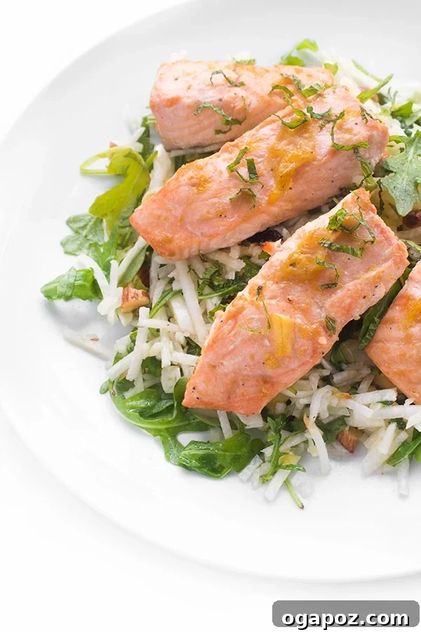 Wholesome Meals in Minutes 10 Roasted Brown Sugar Salmon with Orange Jicama Slaw on a plate with fresh greens.