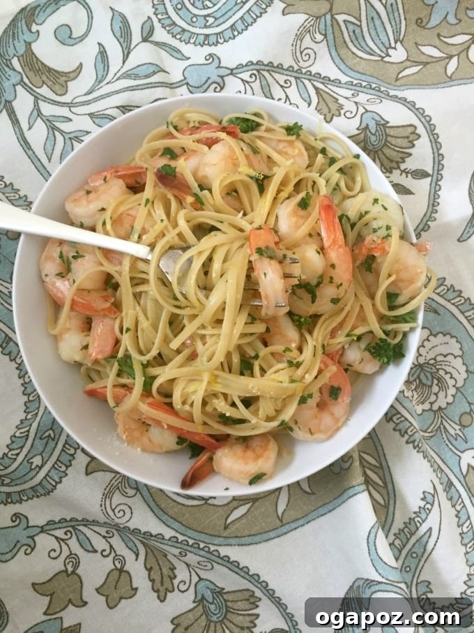Wholesome Meals in Minutes 3 Platter of 15 Minute Shrimp Linguine with Lemon Garlic Butter Sauce, garnished with fresh herbs.