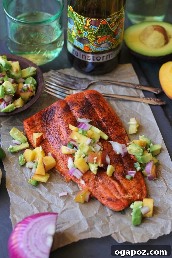 Wholesome Meals in Minutes 9 Smoky Broiled Sockeye Salmon with Peach-Avocado Salsa, served on a plate.