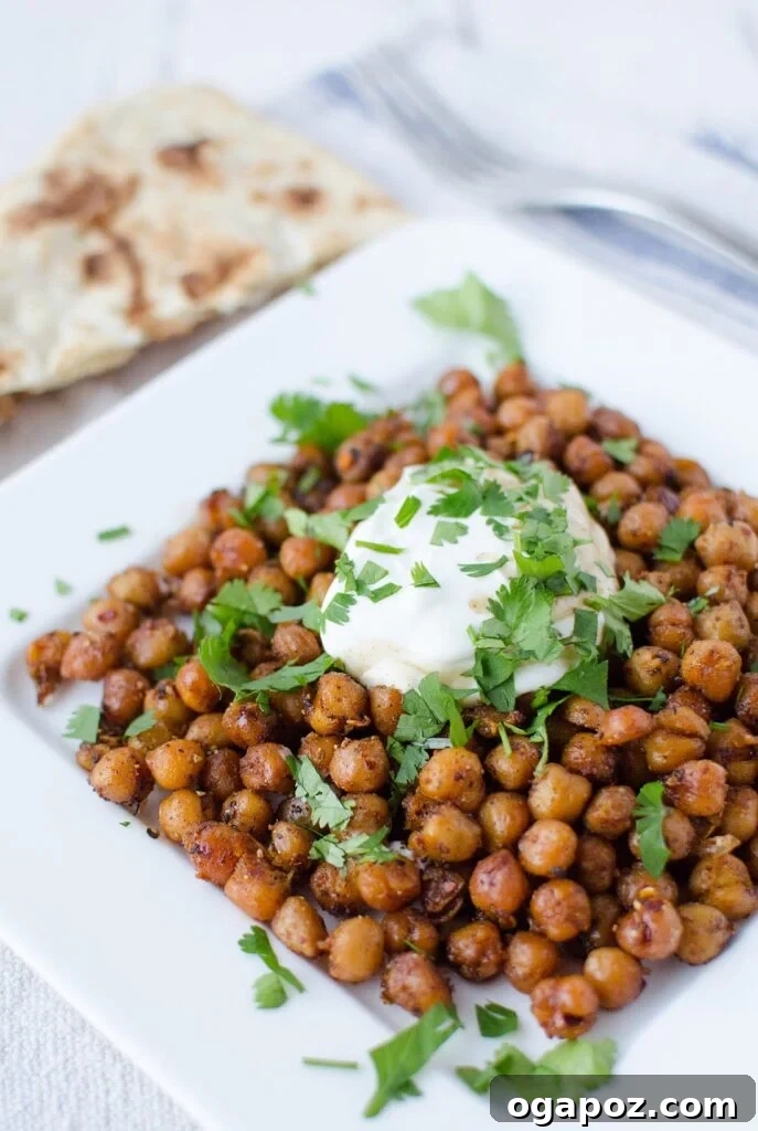 Wholesome Meals in Minutes 19 A bowl of Quick Indian Chickpeas, garnished with fresh cilantro.