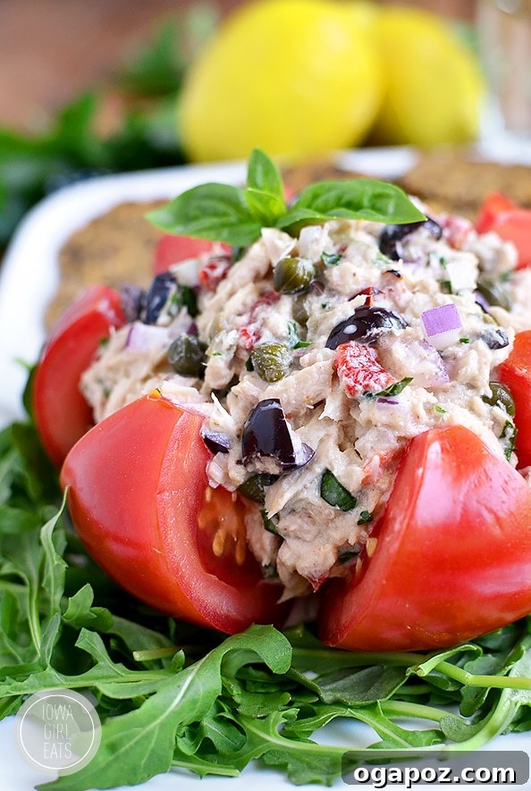 Wholesome Meals in Minutes 31 Mediterranean Tuna Salad in a bowl with fresh herbs and vegetables.