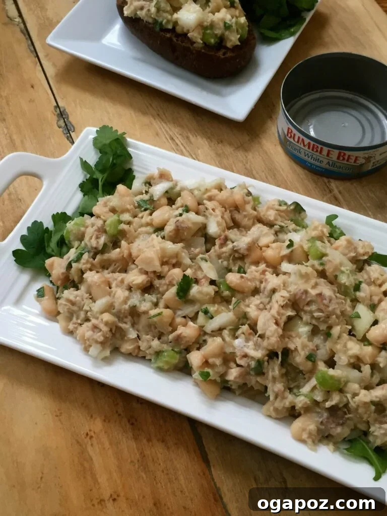 Wholesome Meals in Minutes 33 Italian Style Tuna Salad garnished with fresh basil and tomatoes.
