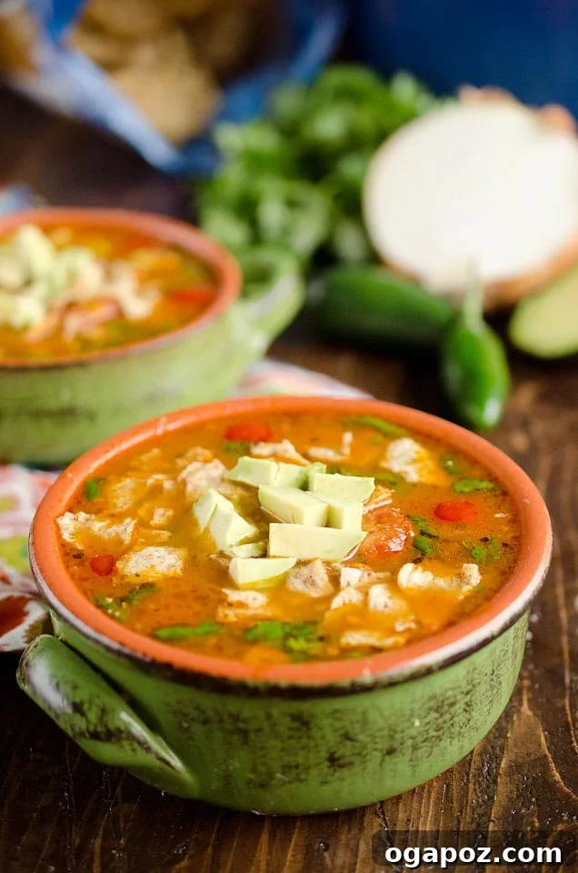 Wholesome Meals in Minutes 25 A bowl of 15 Minute Taco Soup, garnished with fresh cilantro and sour cream.