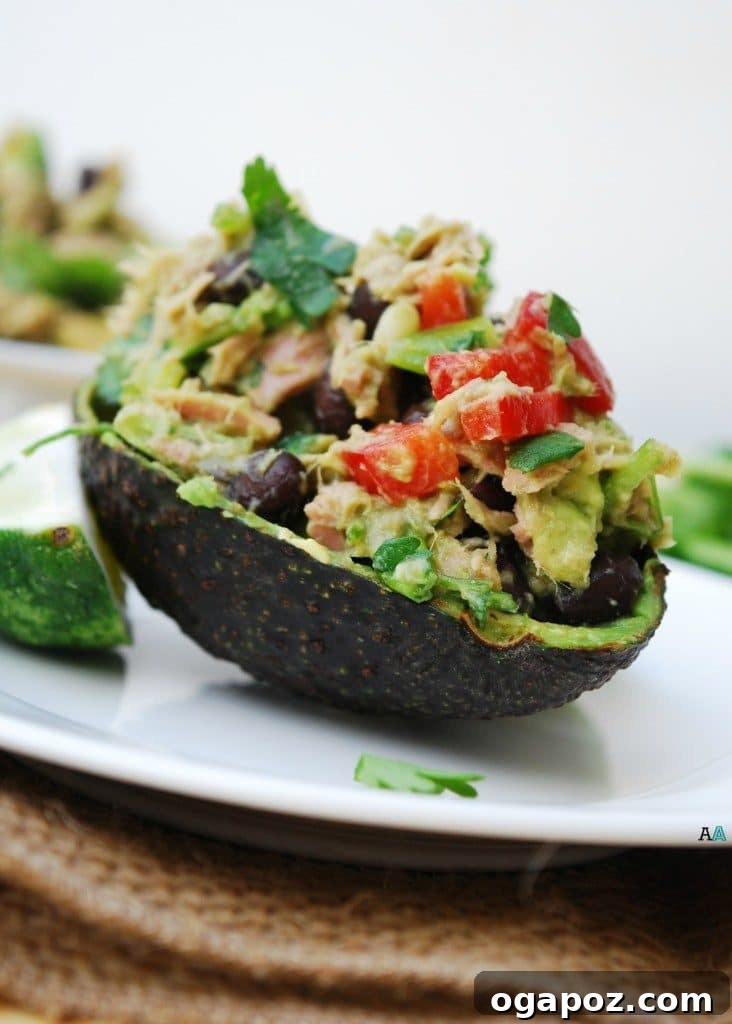 Wholesome Meals in Minutes 30 Mexican Tuna Salad served in a bowl with avocado and tortilla chips.
