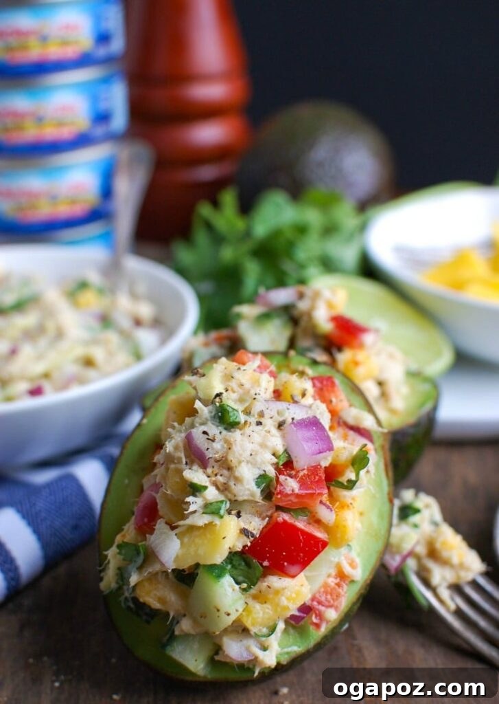 Tropical Tuna Avocado Bowls 3 Tropical Tuna Stuffed Avocado is the perfect, quick and healthy lunch at your desk or on-the-go. Fresh mango, cilantro, fresh vegetables and lime juice is mixed with Solid White Albacore Tuna and Greek Yogurt and then stuffed in a delicious avocado.