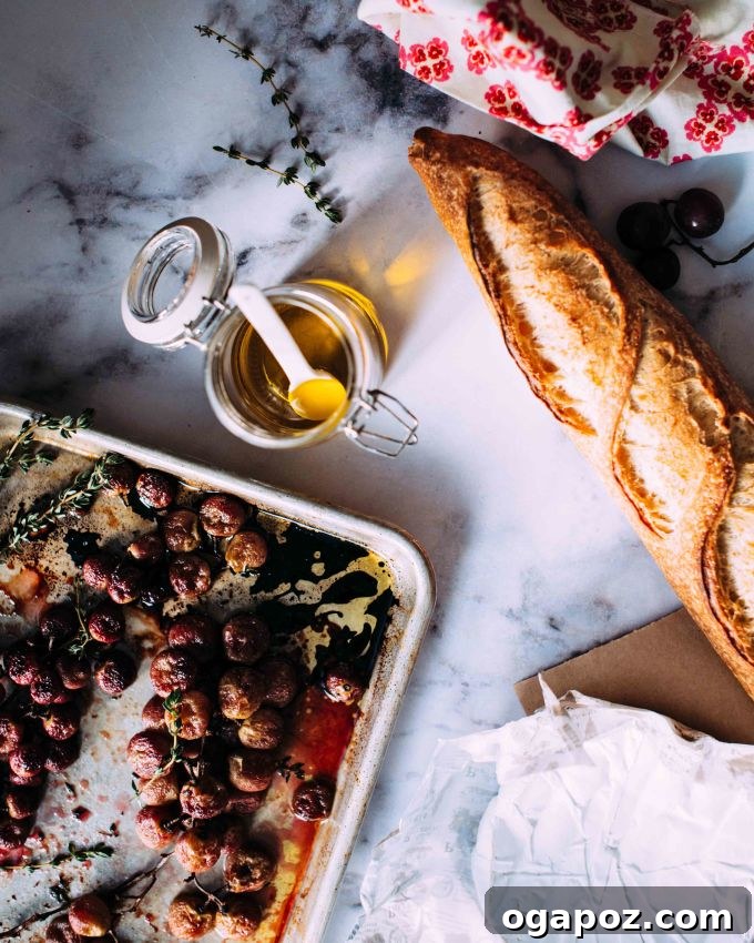 Caramelized Grape Camembert Crostini 4 Roasted grapes on a pan for camembert crostini.