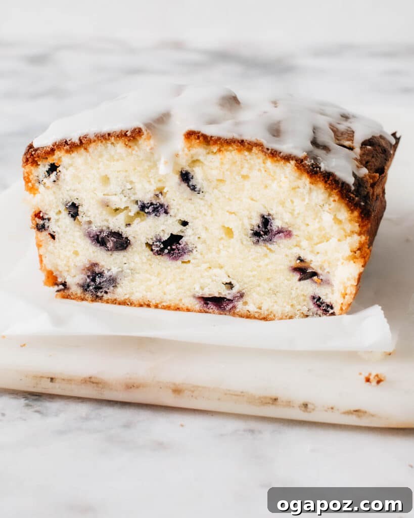Luscious Blueberry Pound Cake 2 A beautifully sliced blueberry pound cake revealing its moist, tender crumb and perfectly distributed blueberries.