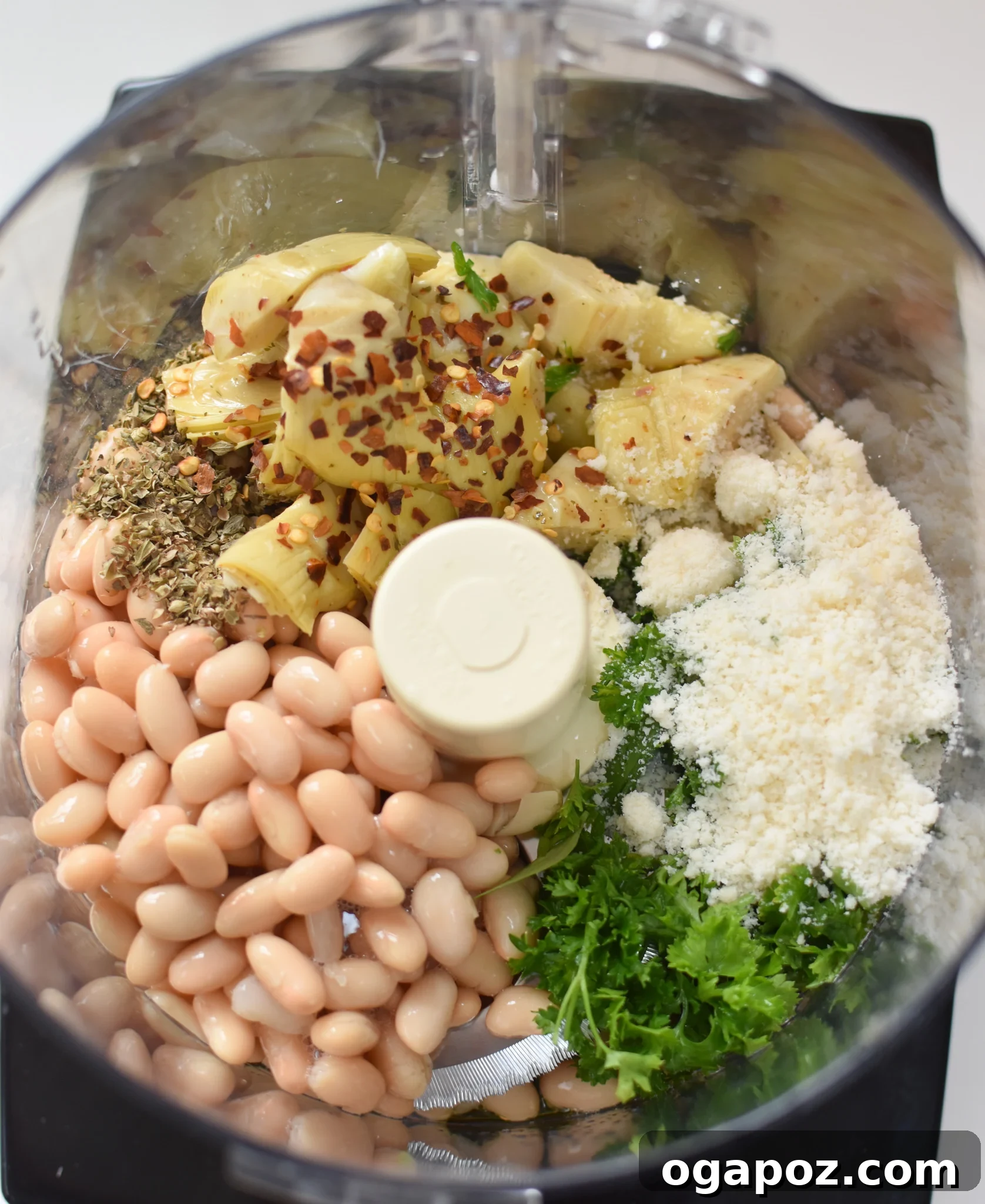 Creamy White Bean Artichoke Dip 4 All the ingredients for White Bean Artichoke Dip gathered in a food processor, ready to be blended.