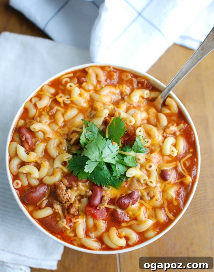 Hearty Slow Cooker Turkey Chili Mac and Cheese 3 Another enticing view of the Crock-Pot® Turkey Chili Mac and Cheese, highlighting its hearty texture and appealing presentation.
