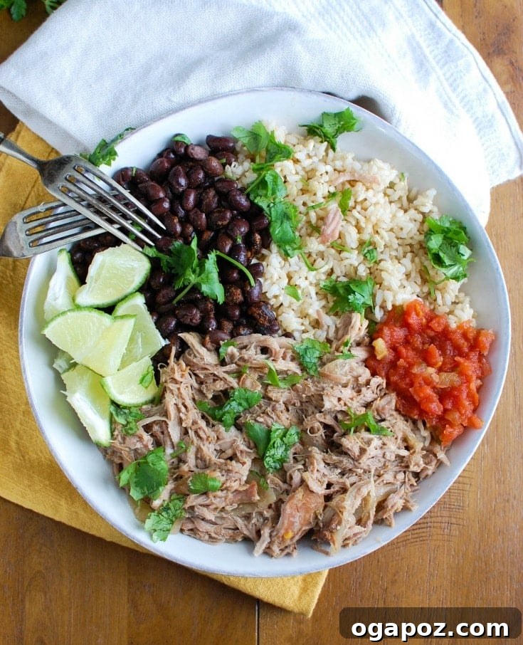 Slow Cooker Mojo Pork Rice Bowls 3 Slow Cooker Cuban Pork Rice Bowls with a side of fresh salsa, highlighting the vibrant colors and fresh ingredients used in the dish.