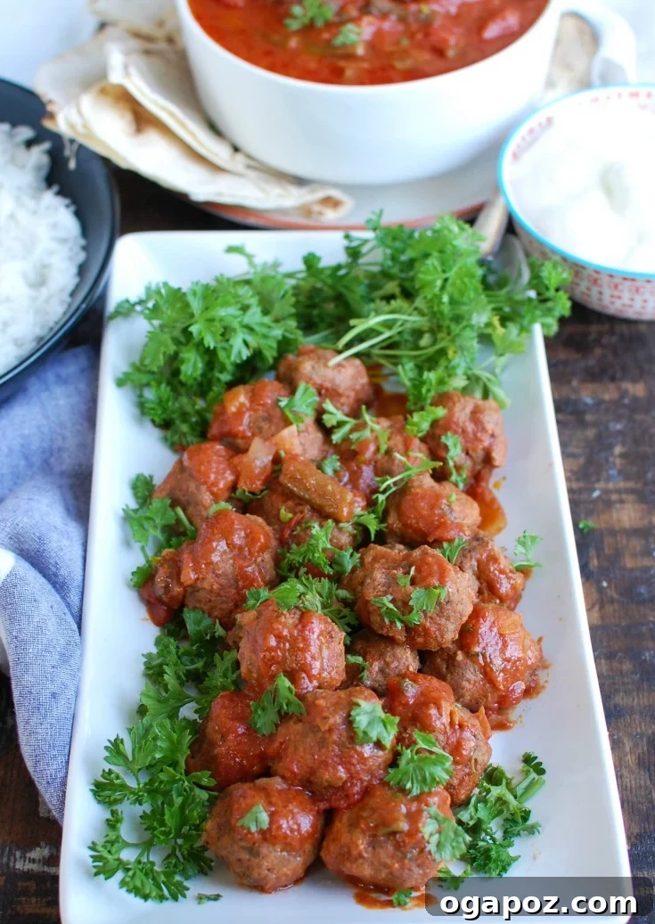 Tender Slow Cooker Mediterranean Beef Meatballs 7 Slow Cooker Mediterranean Beef Meatballs with Lebanese Green Beans is full of warm spices and slow cooks in your crockpot to make dinner easy. Beef meatballs are spiced with Mediterranean flavors and slow cooker in Lebanese green beans creating the perfect sauce paired with the meatballs and rice.