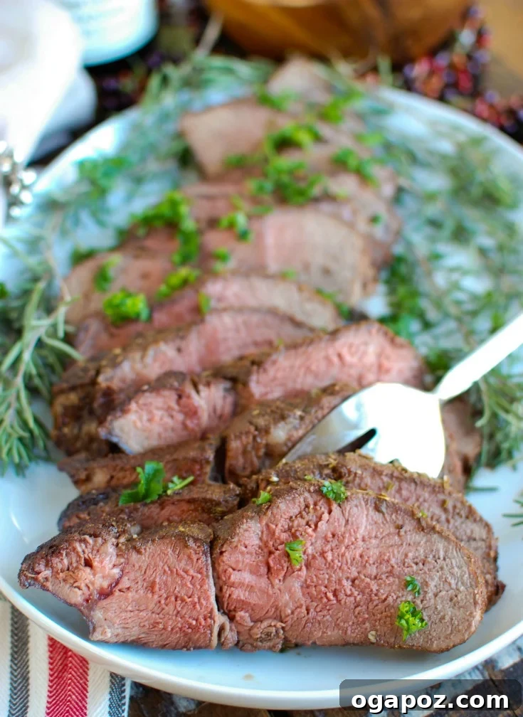 Sun-Kissed Herb-Crusted Sirloin Roast 2 A beautifully roasted Mediterranean Crusted Sirloin Beef Roast, ready to be carved, featuring a rich, browned crust.