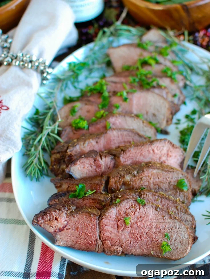 Sun-Kissed Herb-Crusted Sirloin Roast 4 Close-up of a sirloin beef roast being prepared with the Mediterranean spice rub, showing the rich texture of the seasoning.