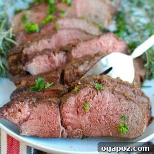 Mediterranean Crusted Sirloin Beef Roast, perfectly cooked and sliced, showcasing its tender interior and crispy crust.