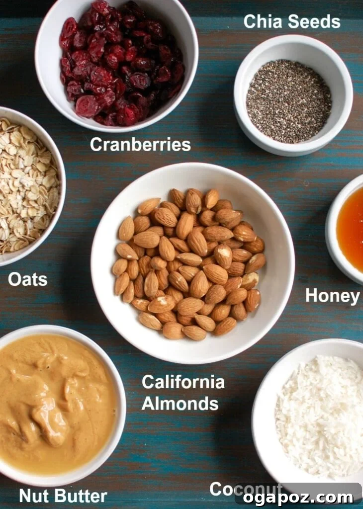 Almond Cranberry Energy Balls 3 A selection of wholesome ingredients laid out on a table, including oats, almonds, cranberries, and almond butter, for making energy bites.