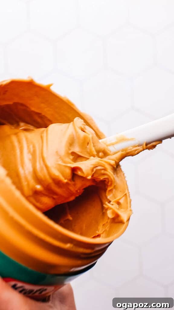 Decadent Peanut Butter Banana Chocolate Bites 5 Close-up image of stirring creamy peanut butter, ready to be spread.
