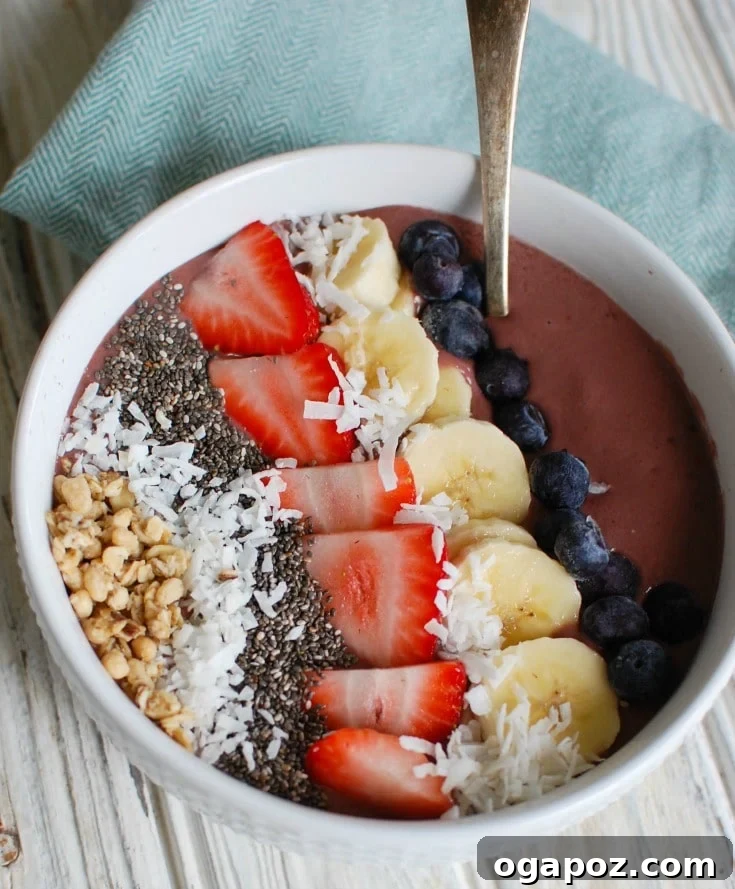 Vibrant Chia Fruit Bowl 2 A vibrant Chia Seeds Fruit Bowl with a blue napkin, ready to be enjoyed.