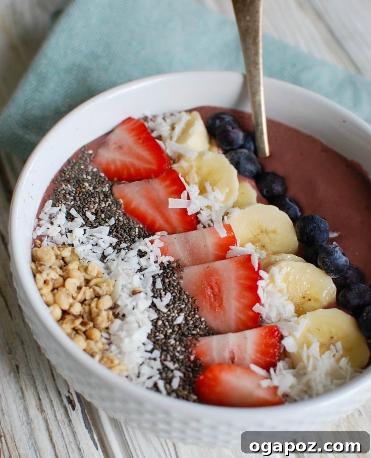 Vibrant Chia Fruit Bowl 3 A close-up of a Chia Seeds Fruit Bowl with a spoon, showing its inviting texture.