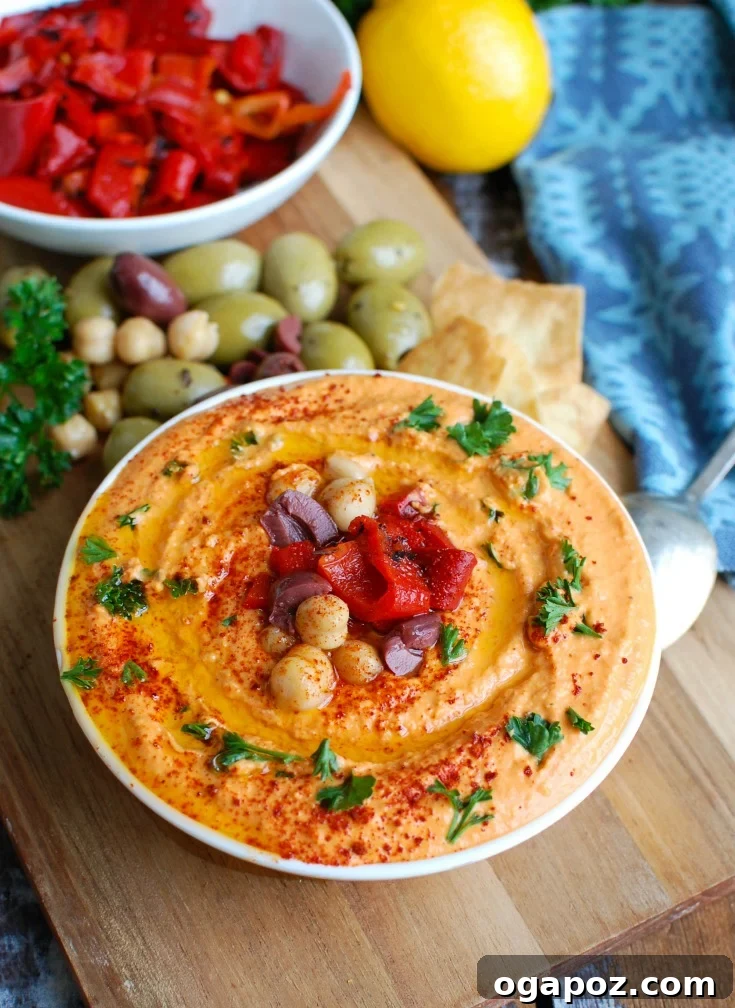 Creamy Roasted Red Pepper Greek Yogurt Hummus 4 Ingredients for Roasted Red Pepper Greek Yogurt Hummus laid out on a cutting board, ready for blending.