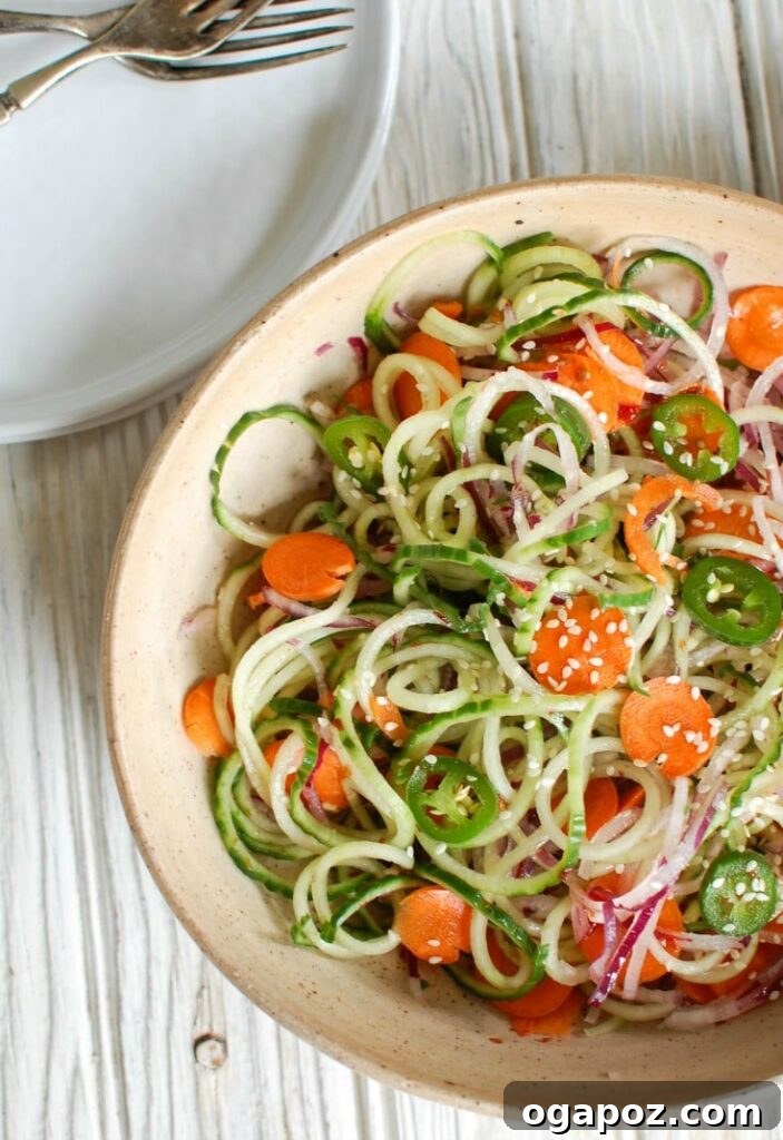 Cool Sesame Cucumber Noodles 3 Asian Cucumber Noodle Salad is a light and healthy salad or side dish. Cucumber and red onion noodles, carrots and jalapeños are tossed with a light Asian dressing.