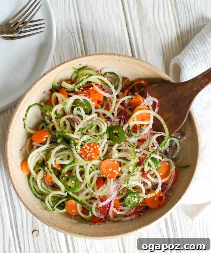 Cool Sesame Cucumber Noodles 4 Asian Cucumber Noodle Salad is a light and healthy salad or side dish. Cucumber and red onion noodles, carrots and jalapeños are tossed with a light Asian dressing.