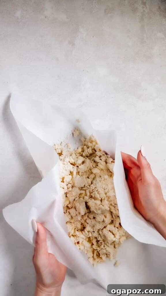 Foolproof Pie Crust You Can Make By Hand 12 Using parchment paper to press the dough together into a disc.
