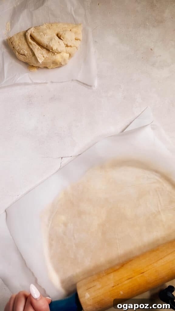 Foolproof Pie Crust You Can Make By Hand 15 Perfectly rolled out pie dough between two sheets of parchment paper.