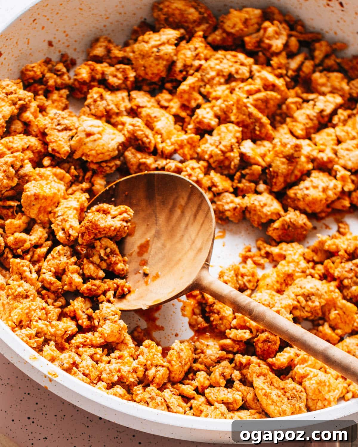 Ground chicken, beautifully seasoned with homemade chicken taco seasoning, sizzling and cooking to perfection in a cast iron skillet.