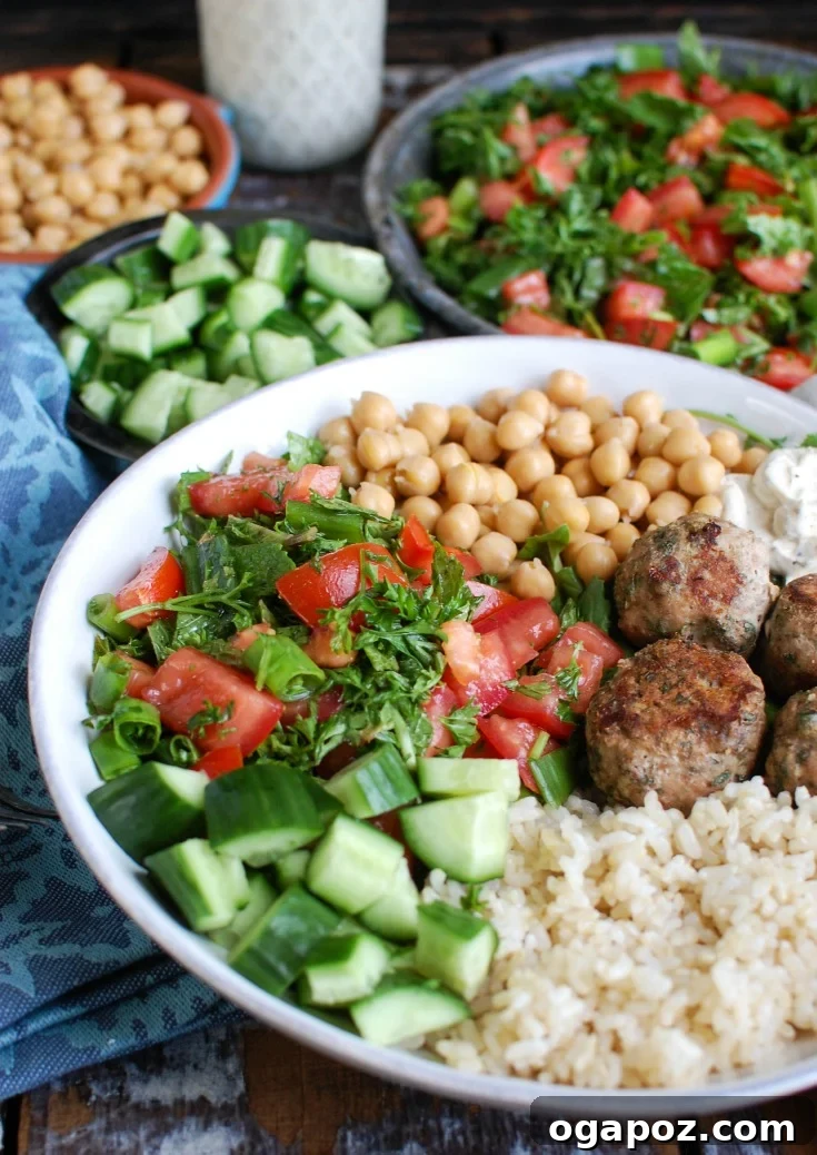 Mediterranean Baked Turkey Meatballs served with a spoon in a rustic bowl.