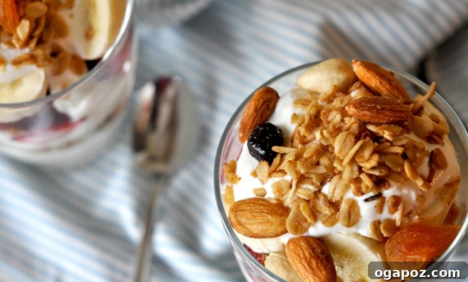 A close-up of the granola mixture before baking, showing oats, nuts, and coconut