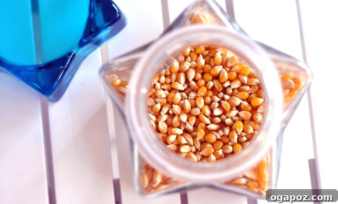 A hand shaking a pot of popping kettle corn