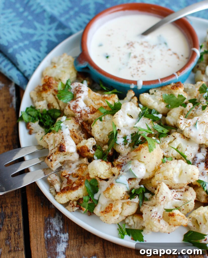 Za'atar Roasted Cauliflower with Creamy Tahini-Yogurt 6 A bowl of Za'atar Roasted Cauliflower, ready to be drizzled with Yogurt Tahini Sauce.