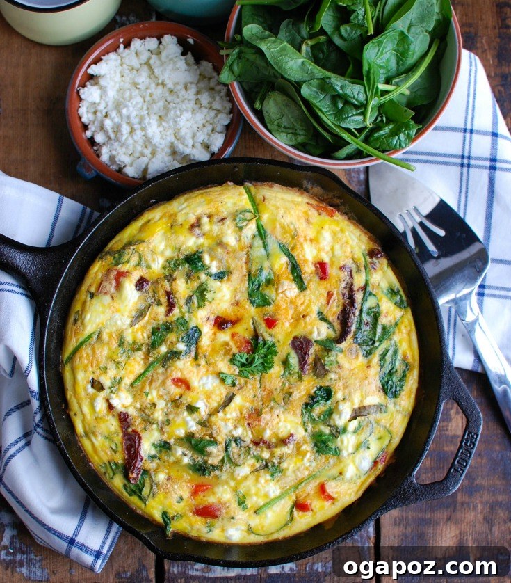 Sun-Kissed Tomato and Tangy Goat Cheese Frittata 5 Individual slices of Sun-Dried Tomato Goat Cheese Frittata arranged on a serving plate, ready to be enjoyed for breakfast or brunch.