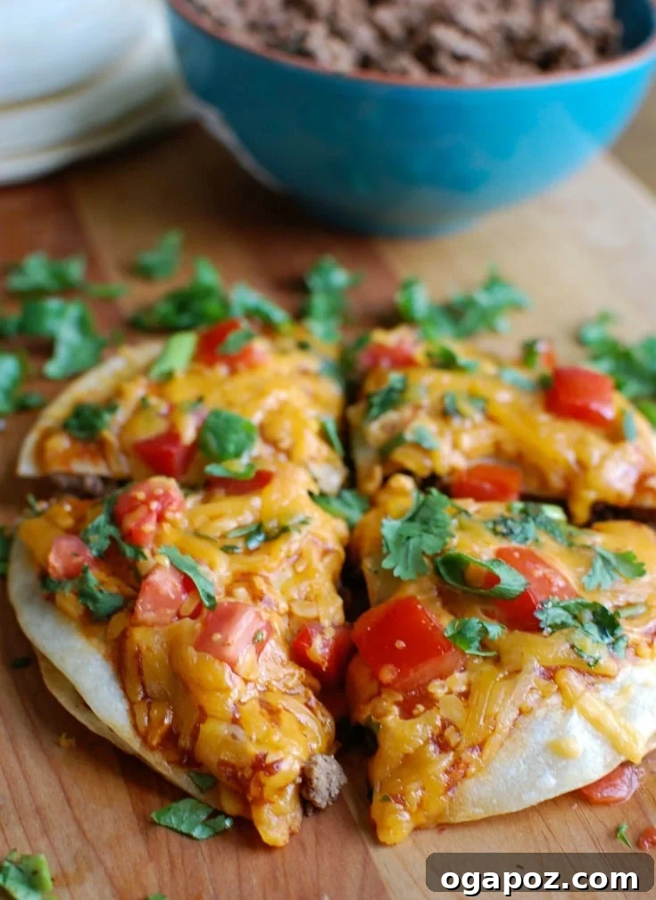 Ultimate Broccoli Cheddar Chicken 11 A vibrant Mexican Pizza with seasoned ground beef, refried beans, salsa, melted Sargento® Monterey Jack cheese, and fresh toppings like tomatoes, green onion, and cilantro.