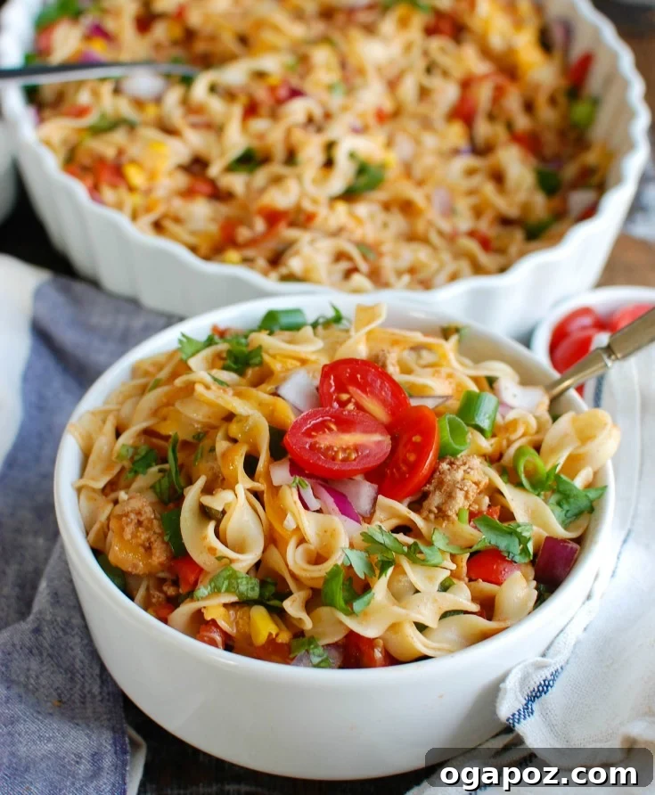 Fiesta Noodle Bake 2 A vibrant Easy Mexican Noodle Casserole, perfect for weeknight meals, made with No Yolks Noodles, colorful vegetables, ground turkey, spices, and melted cheese. A family favorite dinner.