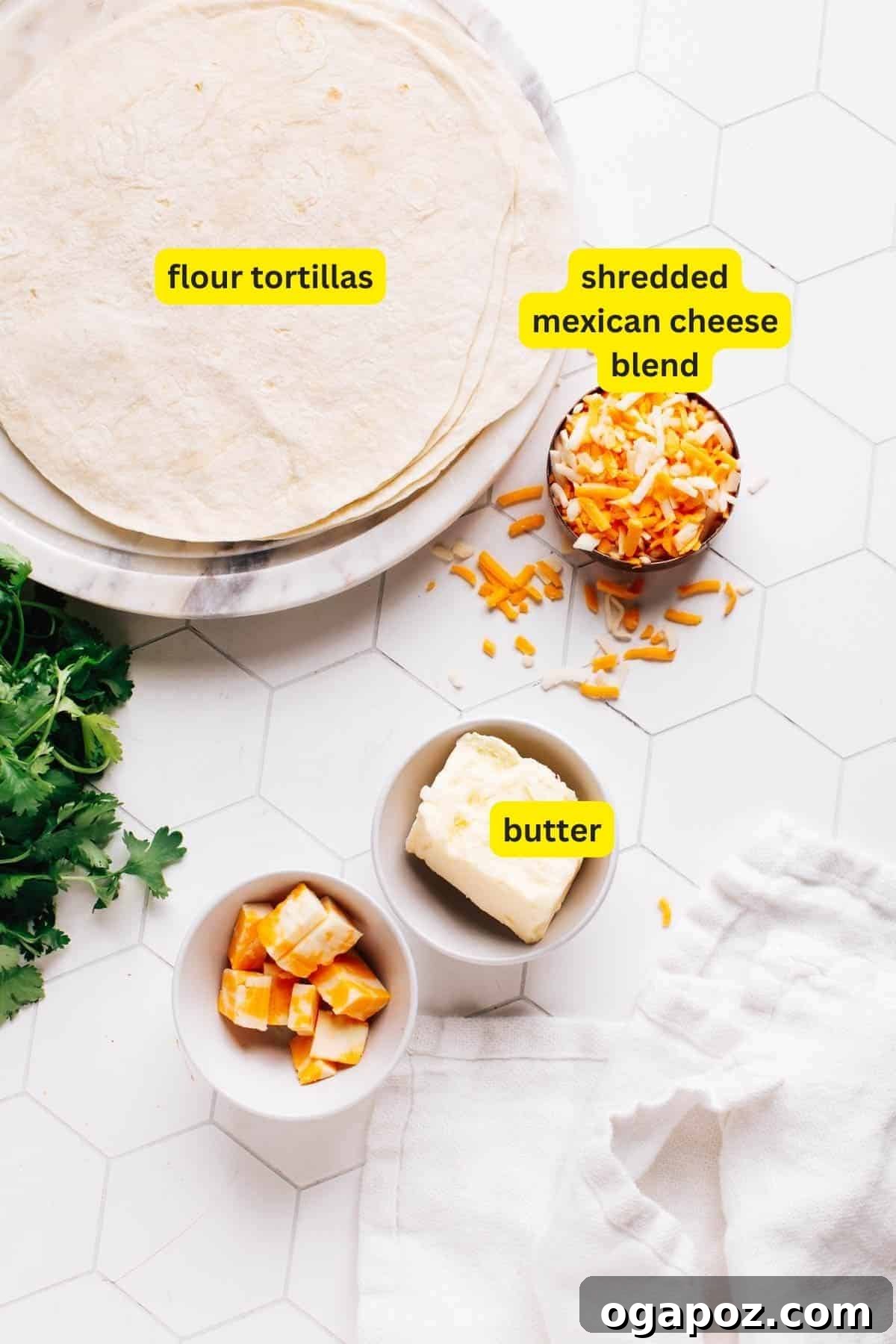 Melted Cheese Delight 4 Ingredients for cheese quesadilla on a kitchen countertop, including flour tortillas, shredded Mexican cheese blend, and butter.