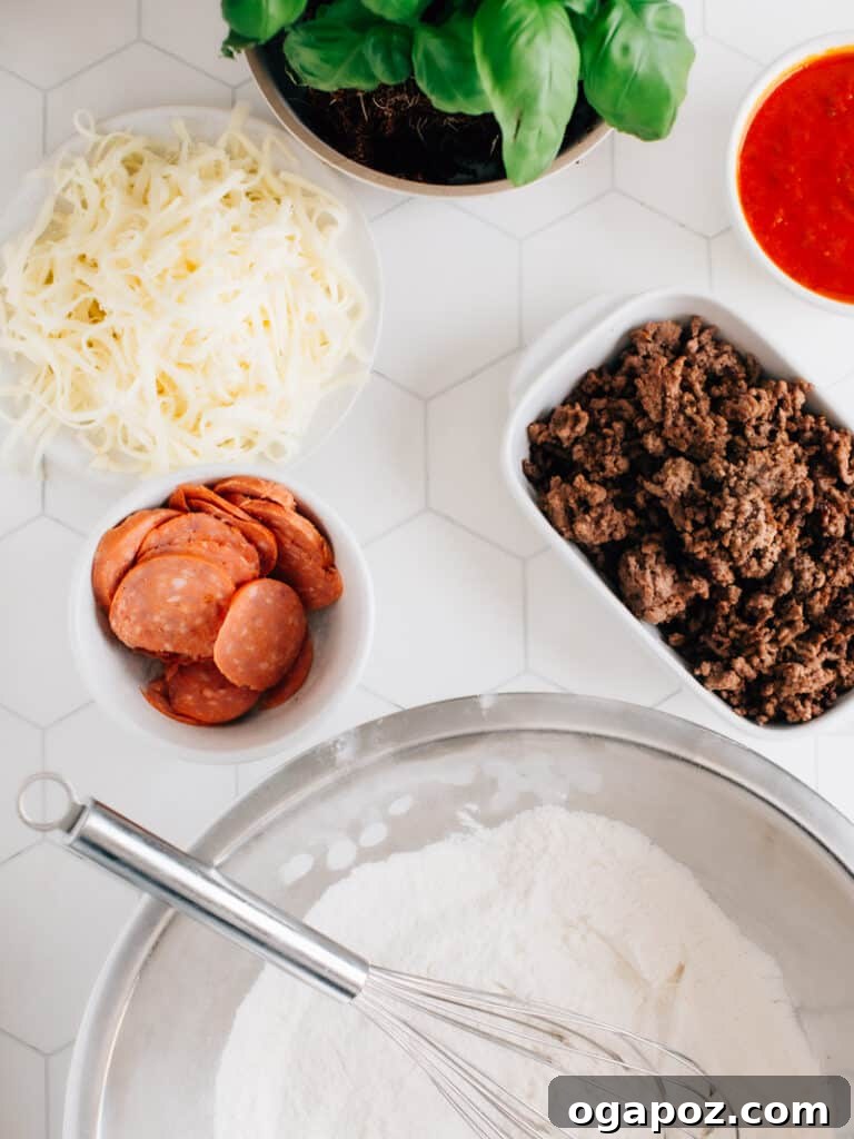 The Best Homemade Pizza Sauce You'll Ever Make 11 A selection of fresh pizza ingredients laid out, including dough, sauce, mozzarella, and fresh basil.