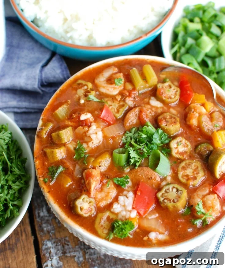 Slow-Cooked Cajun Jambalaya Soup 5 Hearty Crock-Pot® Jambalaya Soup with chicken, andouille sausage, and shrimp, served in a bowl with rice, ready to enjoy.
