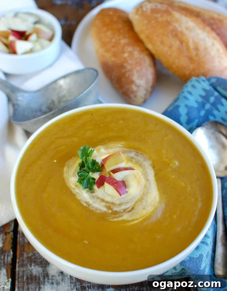 Golden Butternut Apple Slow Cooker Soup 4 Slow Cooker Butternut Squash Apple Soup with cream drizzle and fresh parsley.