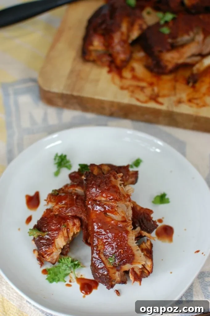 Melt-in-Your-Mouth Slow Cooker Ribs 4 Slow Cooker Barbecue Ribs are fall off the bone tender and full of warm spices and flavor. These ribs cook in a slow cooker saving you time and making this meal easy and perfect for a crowd!