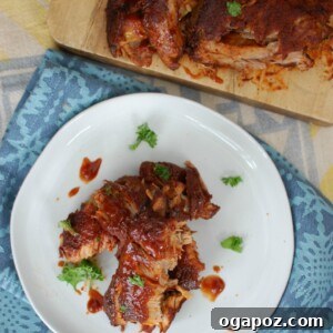 Slow Cooker Barbecue Ribs are fall off the bone tender and full of warm spices and flavor. These ribs cook in a slow cooker saving you time and making this meal easy and perfect for a crowd!