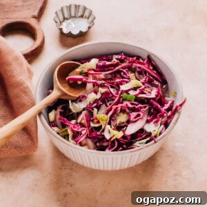 A close-up image of fresh, vibrant cabbage slaw for fish tacos, ready to be served.