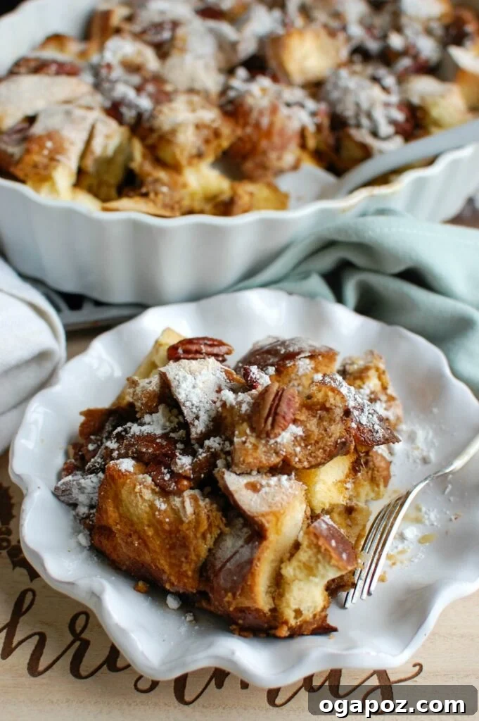 Cozy Overnight Gingerbread French Toast Bake 5 Overnight Gingerbread French Toast Casserole sliced on a plate, ready to be served.