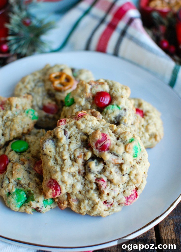 Peanut Butter Pretzel Chocolate Chunk Cookies 3 A bowl of various ingredients for Peanut Butter Pretzel Chocolate Chip Cookies, including butter, sugars, M&Ms, chocolate chips, and pretzels.