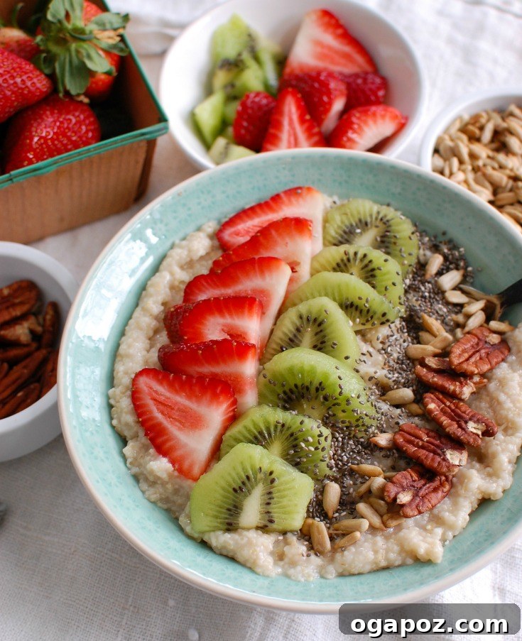 Vibrant Strawberry Kiwi Chia Oat Bran Bowl 3 A close-up of a Strawberry Kiwi Chia Seed Oat Bran Bowl, showing the vibrant colors of fresh fruit and chia seeds on top of creamy oat bran.